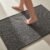 TYUU Bathroom Rugs Non Slip Washable, Super Absorbent Thin Bath Mat Small Quick Dry Low Pile Bathroom Rug, Dark Grey 16″x24″